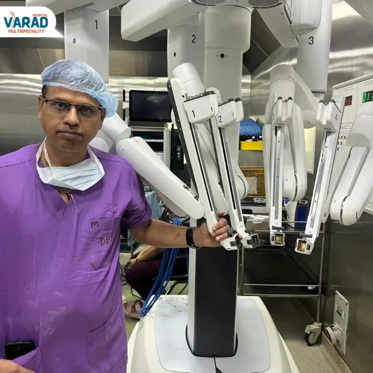 Dr. Vinayak beside Da Vinci Robotic Surgery System in Pune.